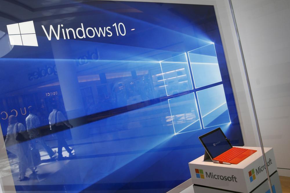 A display for the Windows 10 operating system is seen in a store window of the Microsoft store at Roosevelt Field in Garden City, New York, US. — Reuters