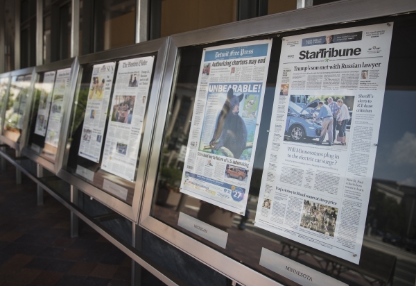 Newspaper front pages are displayed at the Newseum in Washington, Monday. News outlets are seeking permission from Congress for the right to negotiate jointly with Google and Facebook, two companies that dominate online advertising and online news traffic. — AP