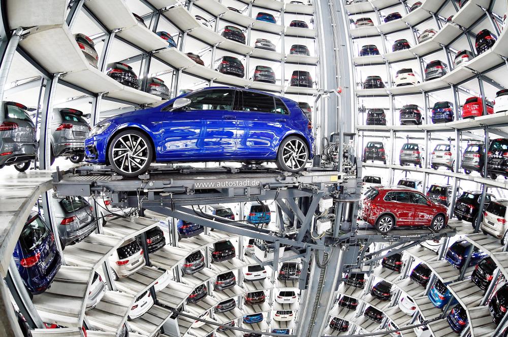 VW Golfs are loaded in a delivery tower at the plant of German carmaker Volkswagen in Wolfsburg, Germany. — Reuters