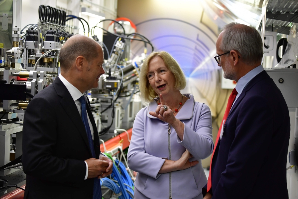 German Education and Research Minister Johanna Wanka (C) chats with Mayor of Hamburg Olaf Scholz (L) and  European XFEL Managing Director Robert Feidenhans'l prior to the official inauguration ceremony of the XFEL international research facility in Schenefeld near Hamburg on Friday. The world's largest X-ray laser promises to shed new light onto very small things by allowing scientists to penetrate the inner workings of atoms, viruses and chemical reactions. — AFP