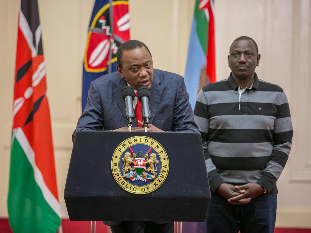 Kenya's President Uhuru Kenyatta flanked by his Deputy William Ruto addresses the nation at State House in Nairobi, Kenya, on Saturday.  — Reuters