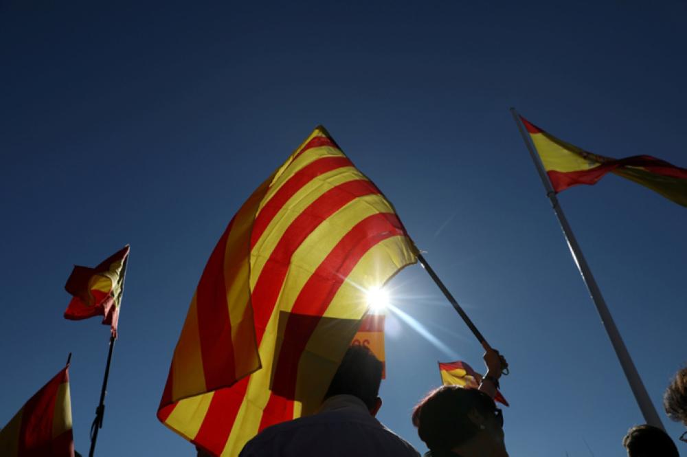 Pro-unity demonstrators gather, the day after the Catalan regional parliament declared independence from Spain, in Madrid, Spain, Saturday. — Reuters