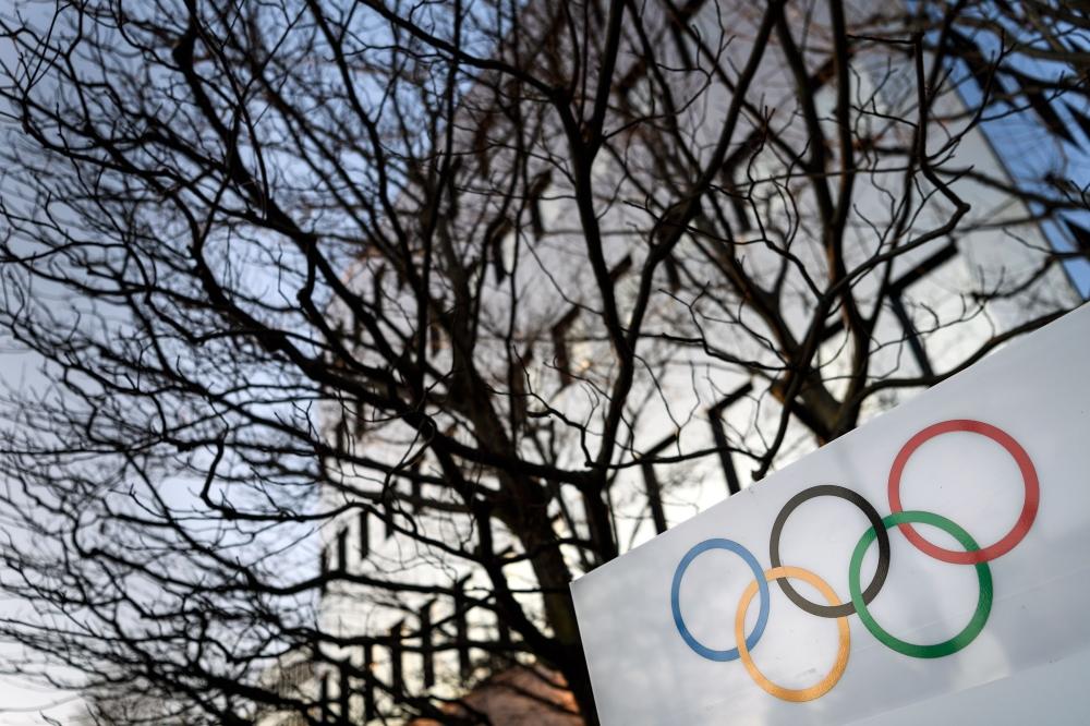 Olympic Rings are seen in front of the International Olympic Committee (IOC) headquarters on December 5, 2017 in Pully near Lausanne. — AFP