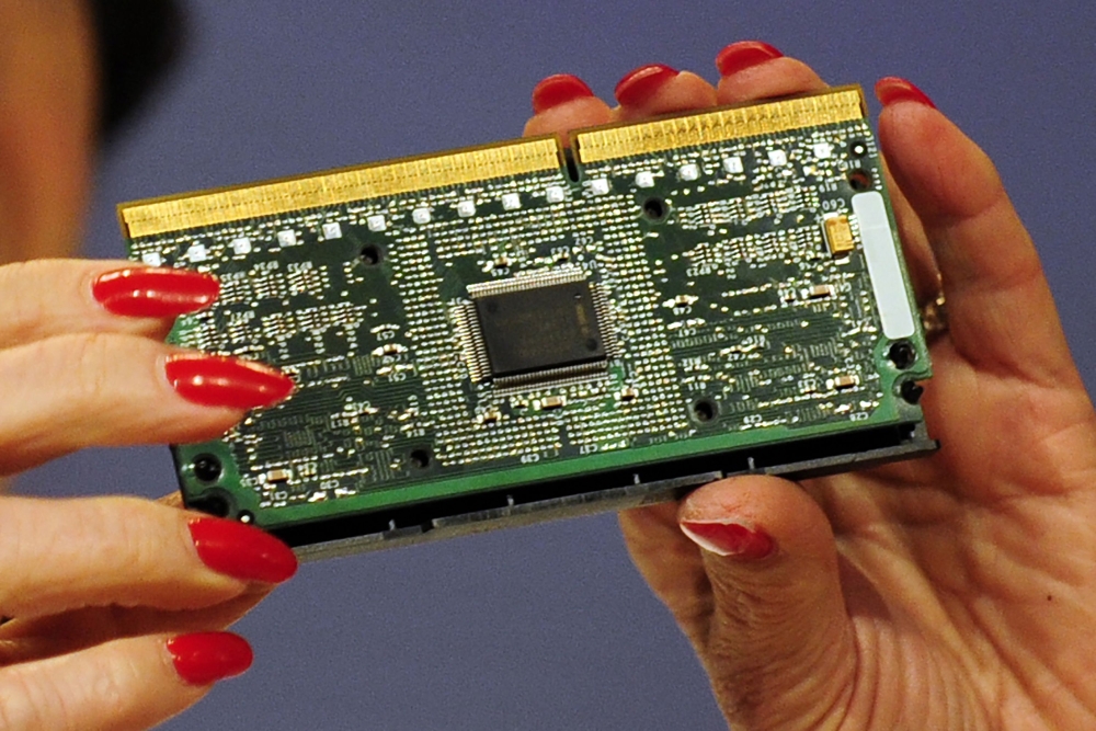 This file photo shows an Intel processor in Brussels. Amid a frantic rush to patch a computer security flaw, experts struggled on Friday to determine the impact of a newly discovered vulnerability which could affect billions of devices worldwide. Computer chipmaking giant Intel — the focus of the first reports on the flaw — said the company and its partners 