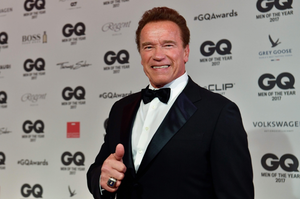 In this file photo taken on November 09, 2017 actor and former California governor Arnold Schwarzenegger poses on the red carpet as he arrives for the GQ 