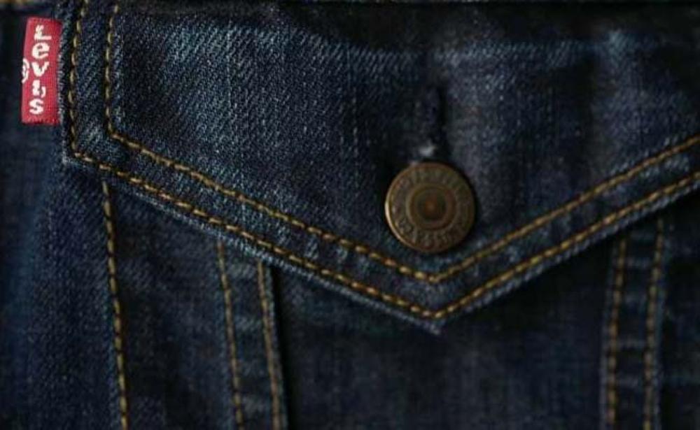 A red tab on the back of a pair of Levi Strauss & Co jeans.