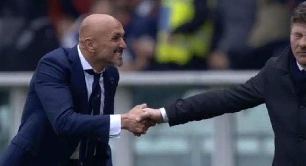 Inter Milan coach Luciano Spalletti, left, is seen as he squeezes Torino coach Walter Mazzarri's hand following their Serie A match in Milan, Italy on Sunday.