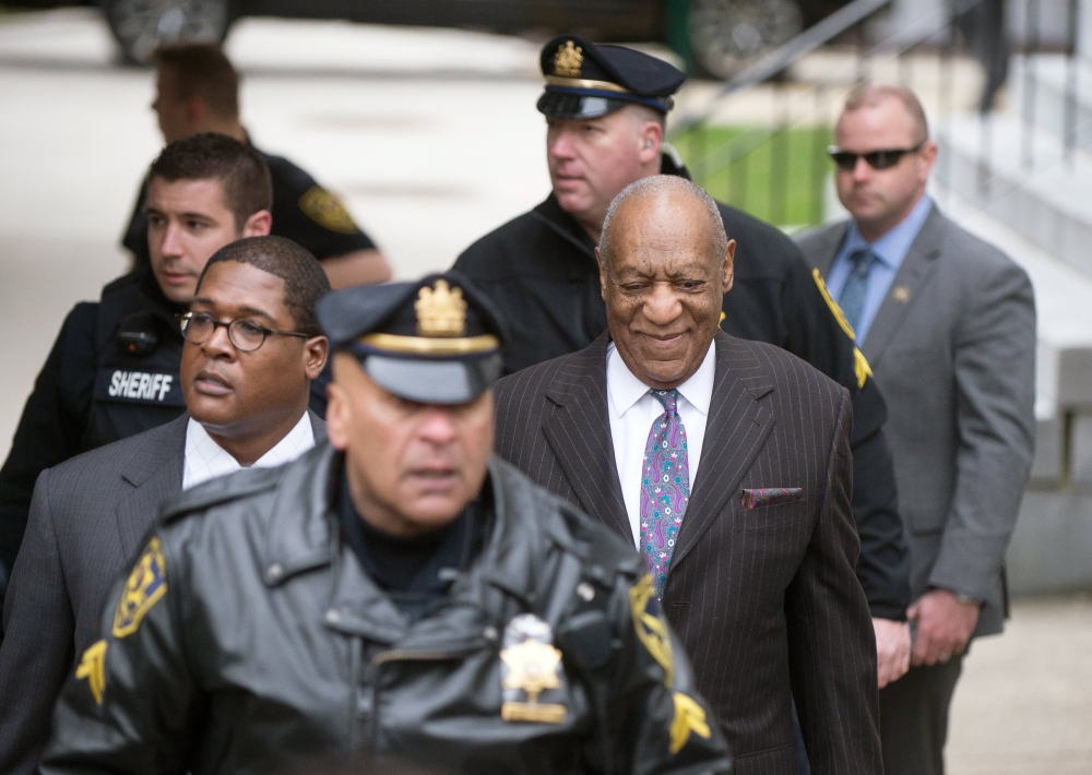 US entertainer Bill Cosby, right, arrives with his aide Andrew Wyatt, left, at the Montgomery County Courthouse for the first day of his retrial regarding charges stemming from an alleged sexual assault in 2004, in Norristown, Pennsylvania on Tuesday. - EPA