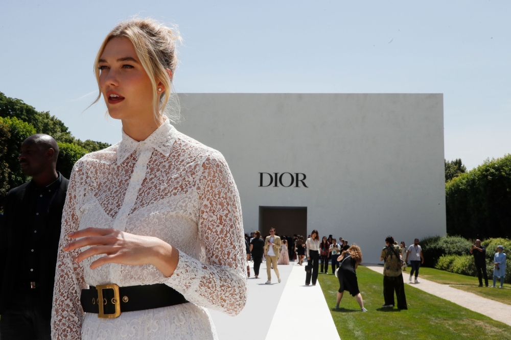 Model Karlie Kloss speaks to journalists before the Christian Dior's 2018-2019 Fall/Winter Haute Couture collection fashion show in Paris on Tuesday. - AFP