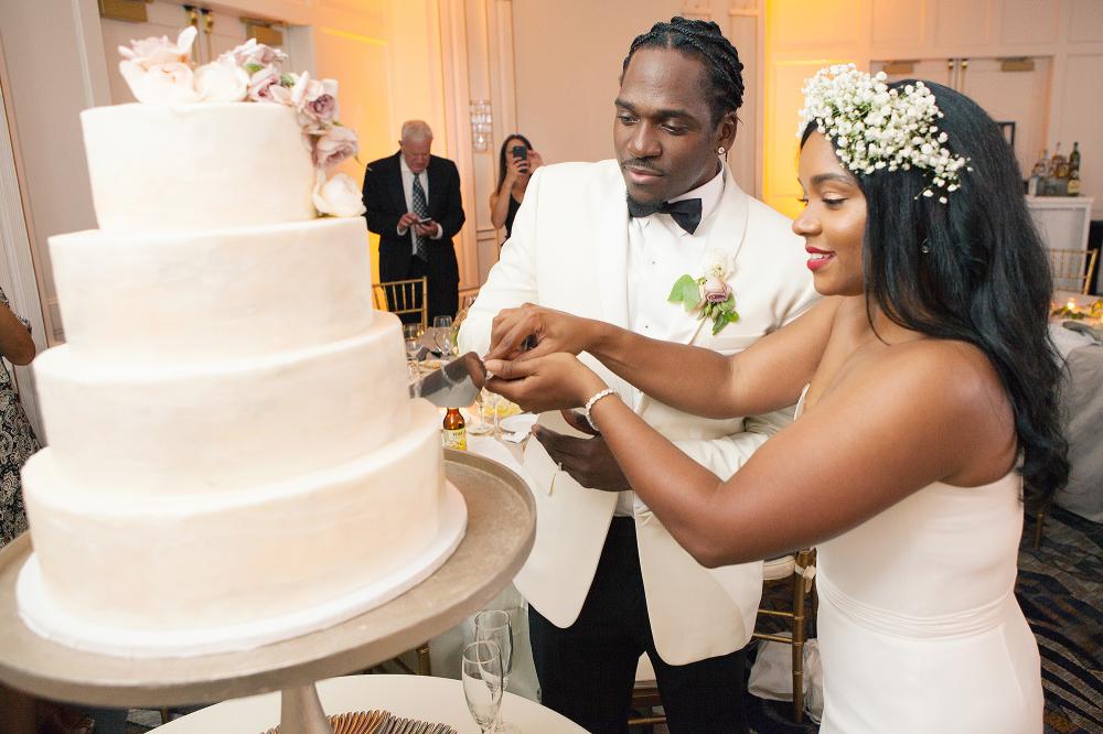 Rapper Pusha T and his wife Virginia Williams are seen as they cut their wedding cake at the Cavalier Hotel in Virginia Beach on Sunday. 