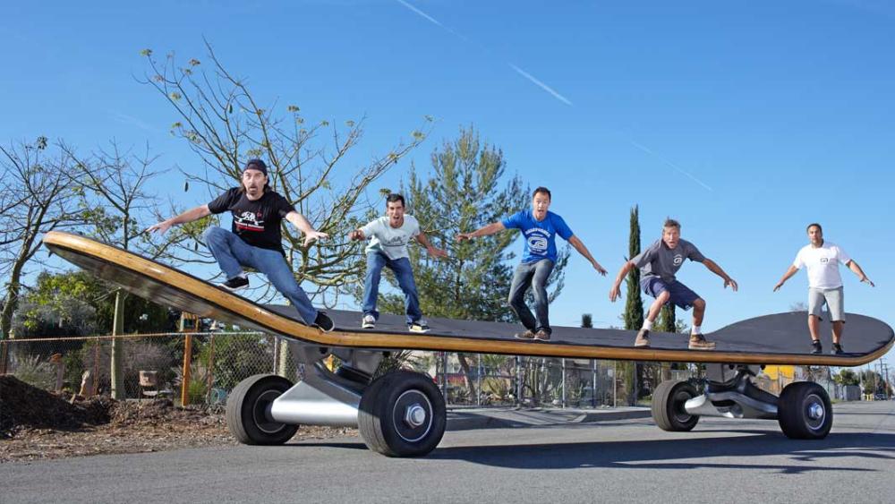 Employees of California Skateparks pose on an 11-meter-long skateboard in Los Angeles, California on Sunday.