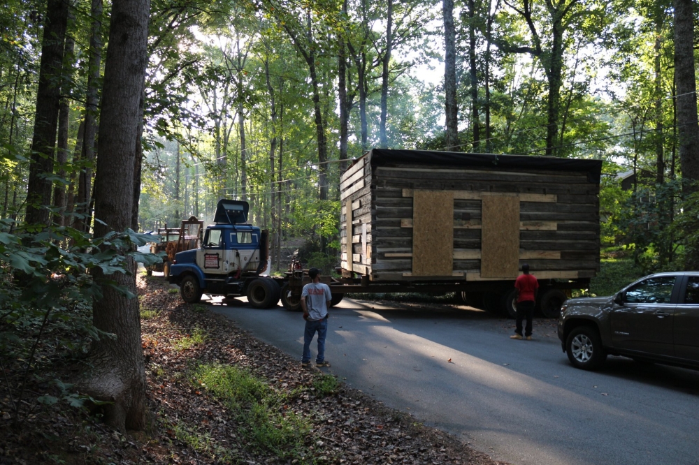 


Crews are seen as they work to unload the historic Manning Cabin onto its new location at the William Root House Museum in Marietta, Georgia on Sunday.