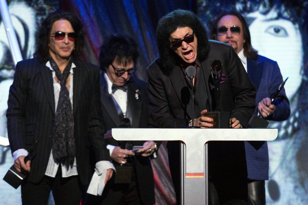 


Gene Simmons (2nd R) of the rock band Kiss speaks next to fellow band members Paul Stanley, Peter Criss and Ace Frehley (L-R) after Kiss was inducted at the 29th annual Rock and Roll Hall of Fame Induction Ceremony at the Barclays Center in Brooklyn, New York April 10, 2014. — Reuters file photo