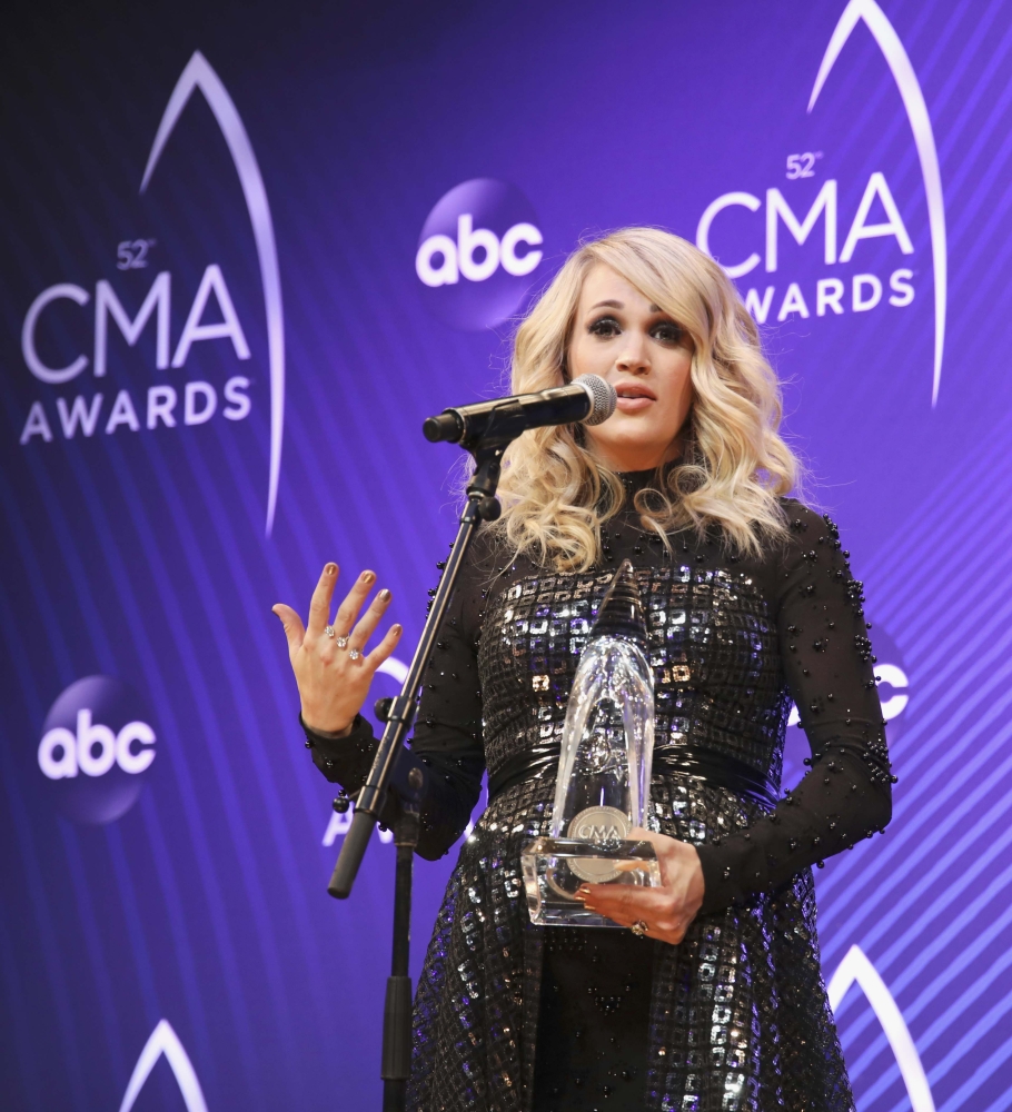 Female Vocalist of the Year Carrie Underwood holds her award at 52nd Country Music Association Awards in Nashville, Tennessee, on Wednesday. — Reuters