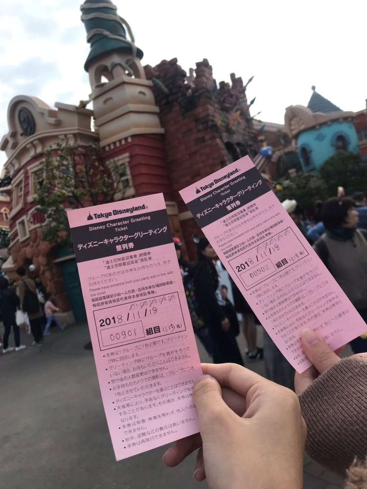 


Visitors hold up their tickets as they wait in line to see Mickey Mouse during an event commemorating the 90th birthday of the Disney character, in Tokyo Disneyland, Urayasu, Chiba Prefecture, Japan. — Reuters