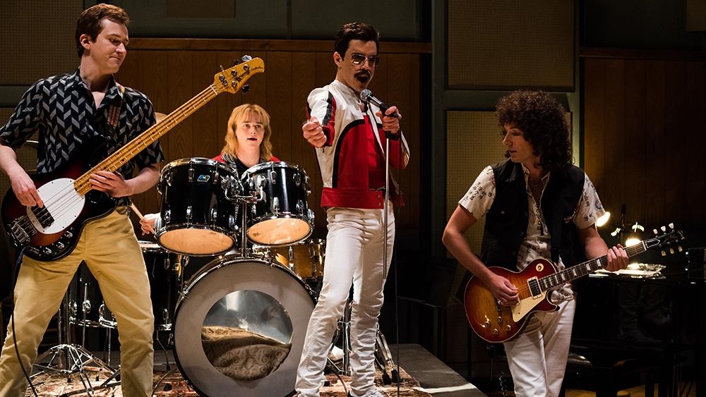 L-R: Joe Mazzello (John Deacon), Ben Hardy (Roger Taylor), Rami Malek (Freddie Mercury), and Gwilym Lee (Brian May) star in Twentieth Century Fox’s BOHEMIAN RHAPSODY. — Photo Credit: Alex Bailey
