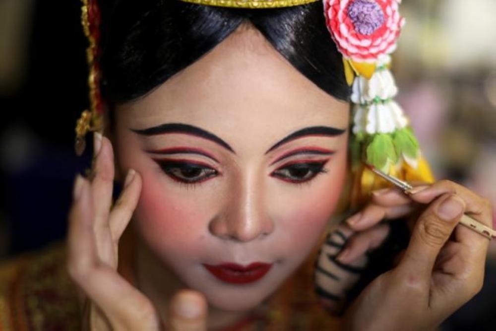 Dancers get ready backstage before a performance of masked theater known as Khon which was recently listed by UNESCO, the United Nations' cultural agency, as an intangible cultural heritage, along with neighboring Cambodia's version of the dance, known as Lakhon Khol at the Thailand Cultural Center in Bangkok, Thailand. — Reuters