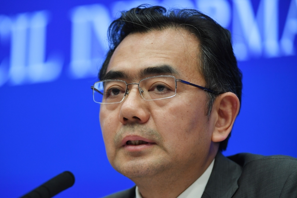 Li Guoping, secretary general of China National Space Administration, speaks at a press conference about China’s Chang’e-4 moon probe in Beijing on Monday. — AFP