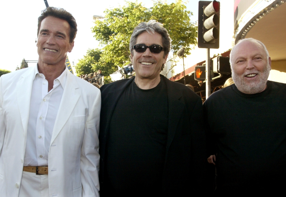 Actor Arnold Schwarzenegger (L), star of the futuristic action thriller 