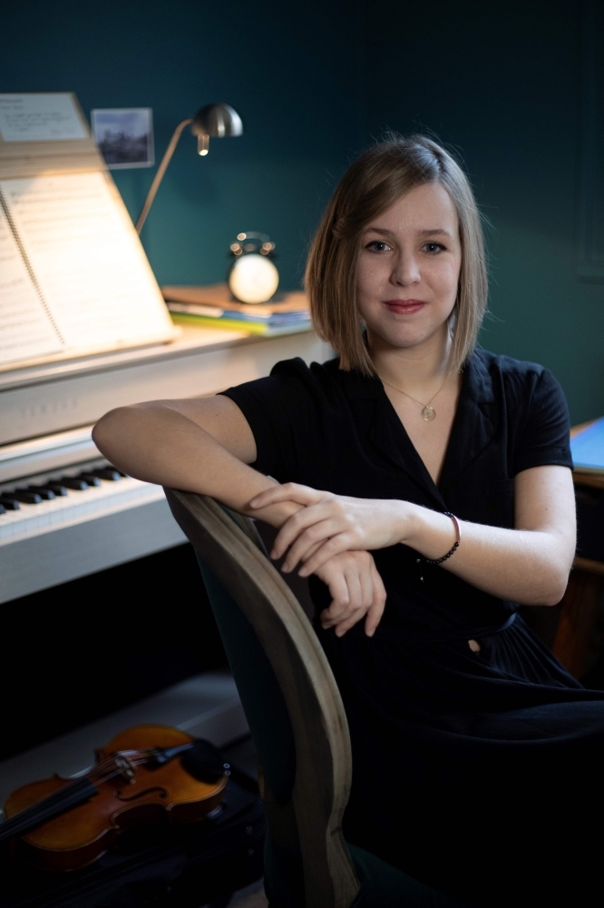 French music composer Camille Pepin poses in her studio in Paris. — AFP