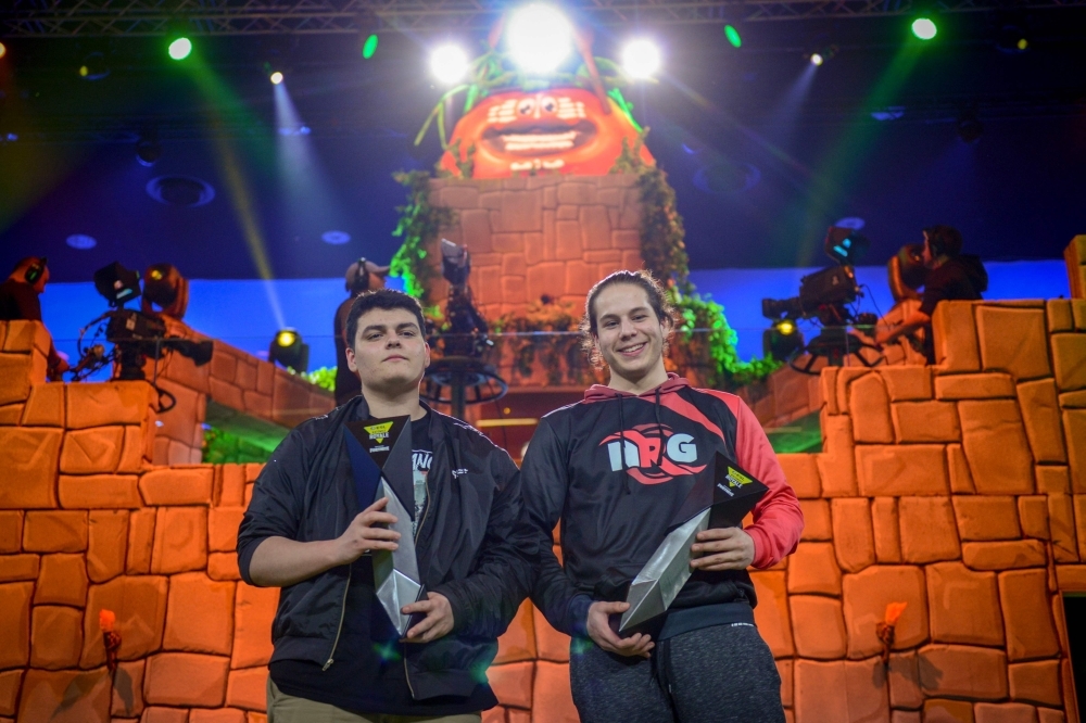 Online gamers Ghost (L) and NRG (R) celebrate after winning the ESL Katowice Royale Featuring Fortnite Tournament during the Intel Extreme Masters Katowice 2019 event in Katowice. World's top gamers vie for $500,000 in prizes at Fortnite International video game tournament. — AFP