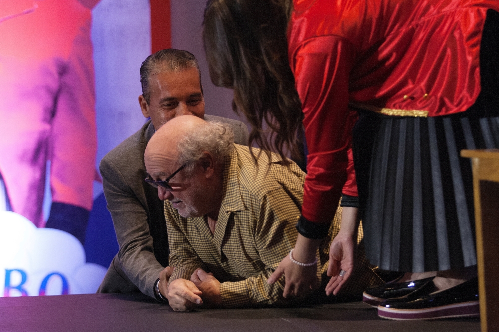 Actor Dany DeVito is pictured after tripping on a step leading to the stage during the promotion of Disney's new movie Dumbo in Mexico City. — Reuters