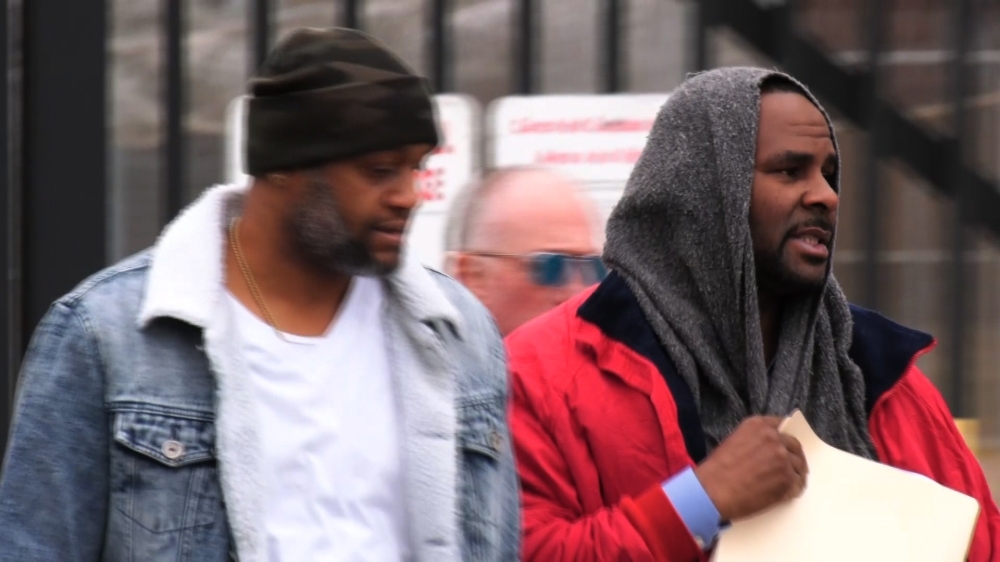This still image from video shows singer R. Kelly (R) upon his release from Cook County jail in Chicago, Illinois, Saturday. — AFP