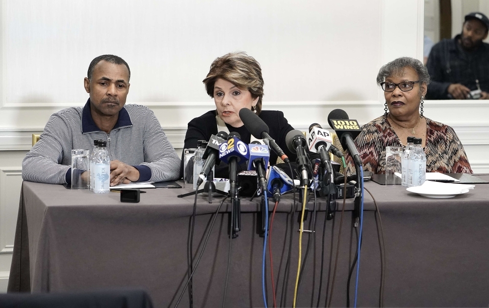 Gary Dennis and wife Sallie represented by attorney (C) Glorida Allred hold a press conference to discuss alleged new R. Kelly tape at Lotte New York Palace in New York City.  — AFP