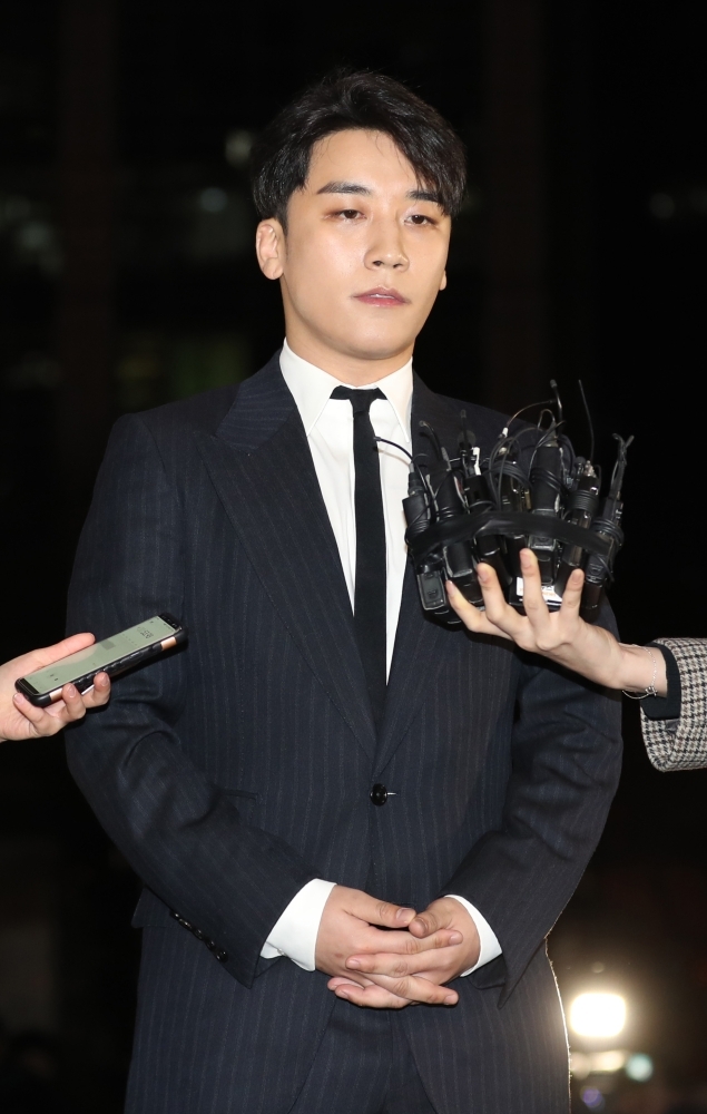 Seungri, a member of popular K-pop boy group Big Bang, arriving for questioning over criminal allegations at the Seoul Metropolitan Police Agency in Seoul. — AFP
