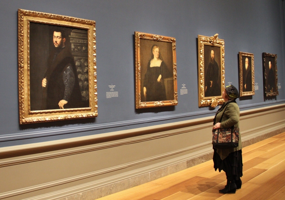 


A woman looks at Jacopo Tintoretto's 