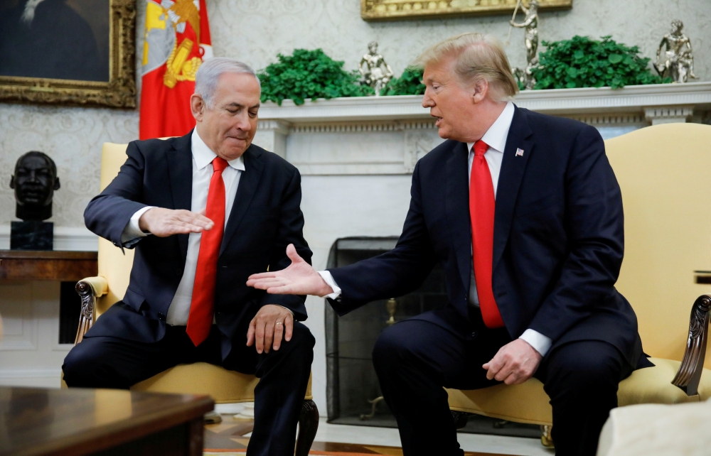 Israel’s Prime Minister Benjamin Netanyahu shakes hands with US President Donald Trump during their meeting in the Oval Office at the White House in Washington in this March 25, 2019 file photo. — Reuters