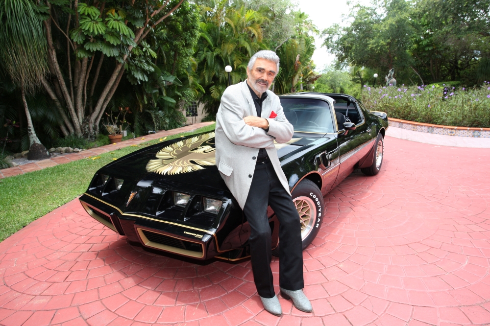 Burt Reynolds stands next to a 1979 Pontiac Trans Am, which was the last Trans Am owned and driven by Reynolds, in this Julien's Auctions photo, released from Culver City, California,. — Reuters