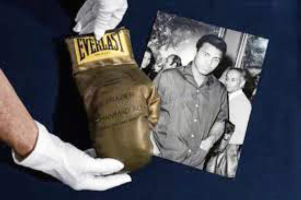A rare gold boxing glove made to commemorate Muhammad Ali's 