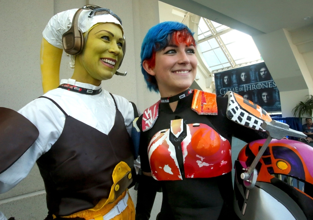 In this file photo taken on July 23, 2016 women play the parts from Star Wars, Hera Syndulla (L) and Sabine Wren during Comic-Con International 2016 in San Diego, California. — AFP