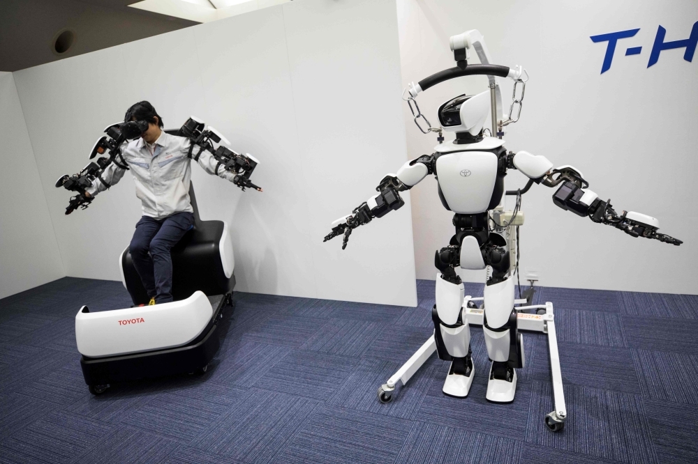 In this picture, Toyota Motor Corp. demonstrates the T-HR3 humanoid robot which will be used during the Tokyo 2020 Olympic and Paralympic Games, in Tokyo. — AFP