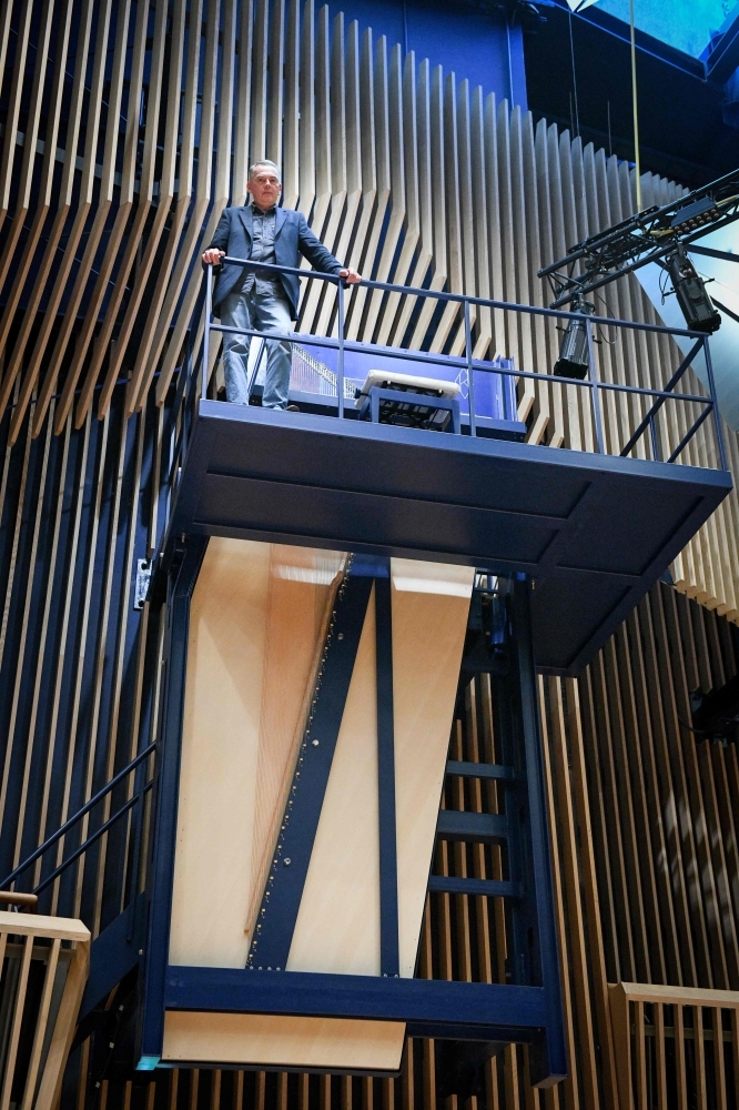Piano constructor and builder David Klavins plays his new creation, the M470i vertical concert grand piano, with a height of 4,70 meters, at the new 