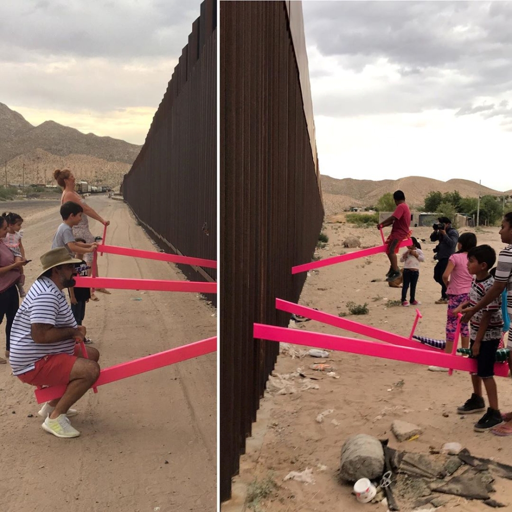 Children and adults play on pink seesaws, installed by Ronald Rael to symbolically bridge the divide and encourage both children and adults to play, along the US-Mexico border in Sunland Park, New Mexico, US on Monday. — Reuters