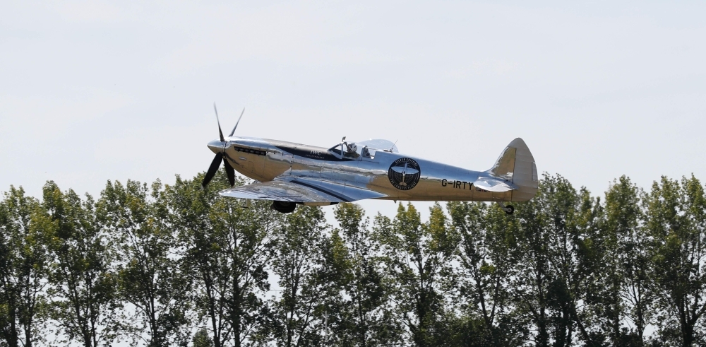 British aviator Matt Jones takes off in a restored World War II Silver Spitfire plane as he begins a round-the-world flight attempt at Goodwood Aerodrome in Chichester, southeast England, on Monday. — AFP