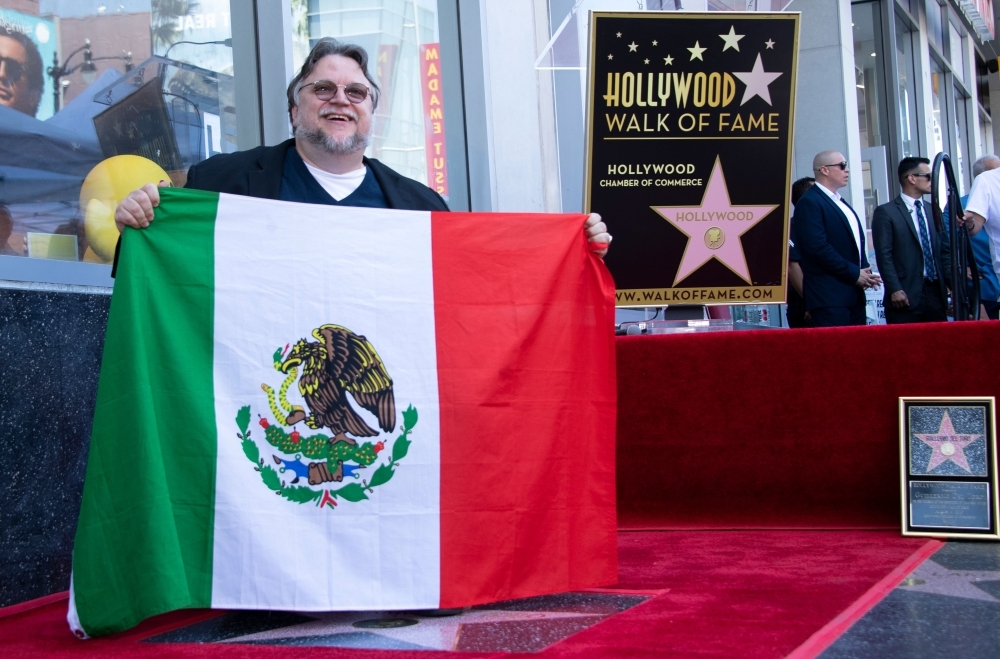 Director Guillermo Del Toro poses during the ceremony for his Star on The Hollywood Walk of Fame, in Hollywood, California, on Tuesday. — AFP
