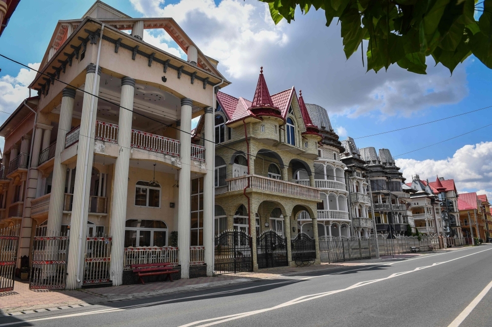  This file photo taken on July 11 shows palaces belonging to Romanian Roma people in Buzescu village, southern Romania. -AFP