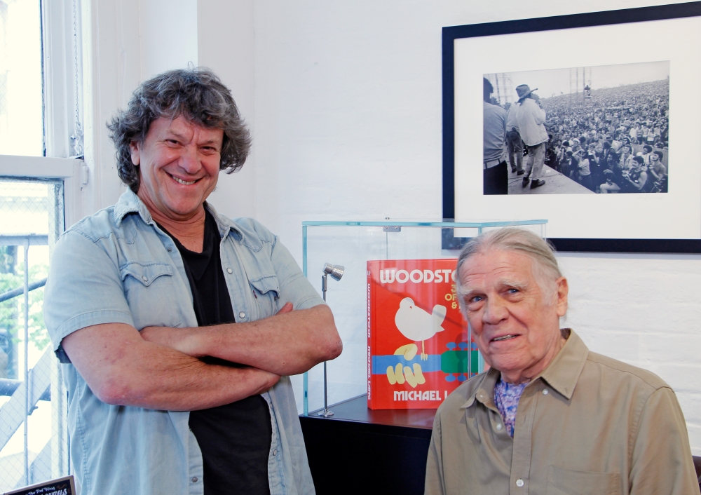 Woodstock producer Michael Lang (L) and Woodstock photographer Henry Diltz pose during a photo exhibit that celebrates the 50th anniversary of Woodstock in New York, on Friday.  -Reuters