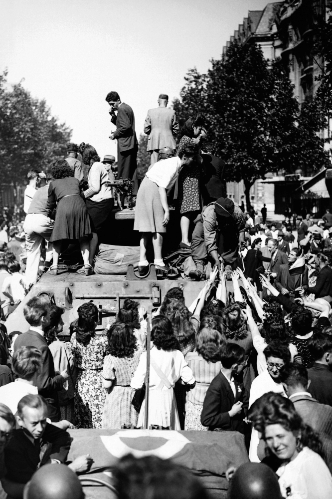 In this file photograph taken on August 25, 1944, Parisians welcome soldiers of the French 2nd Armored Division as they arrive in Paris,  after the battle for the Liberation of Paris during World War II. Part of the great history of France, the week of the liberation of Paris 75 years ago, marked by the uprising against the German occupiers, was also that of small smiling or tragic stories. -AFP
