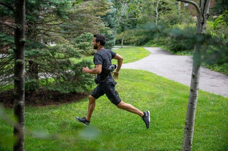 The entire get-up includes a battery that straps around the waist and a motor on the lower back that connects to pull-cables. -AFP