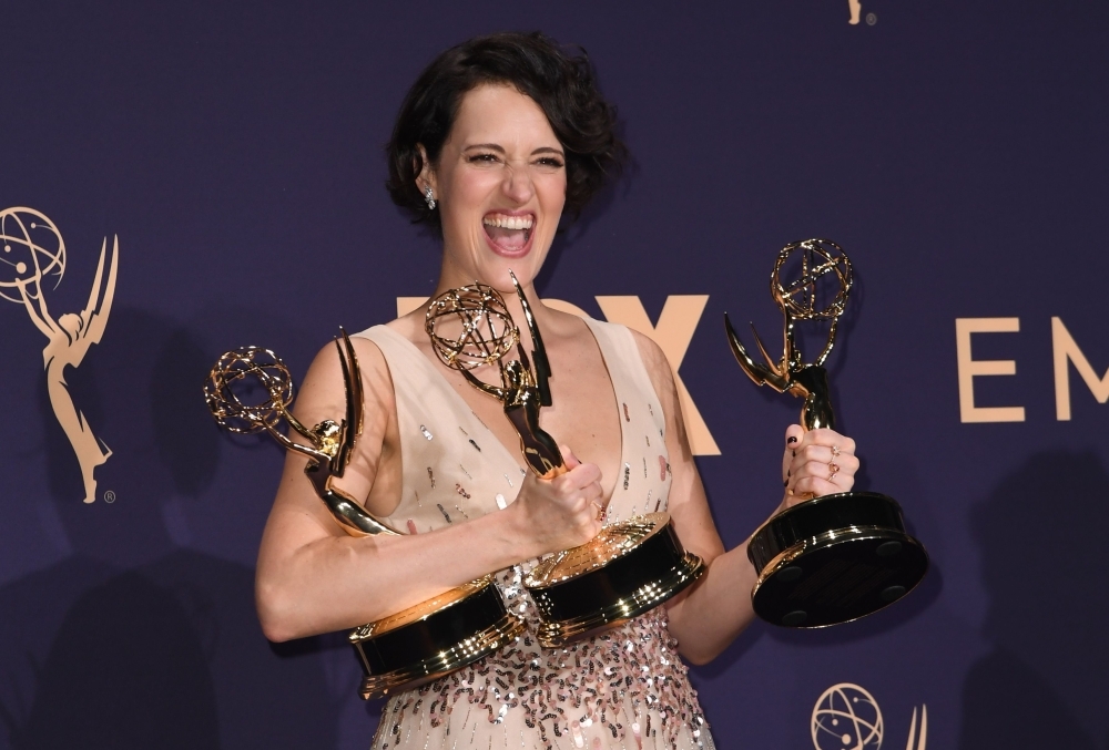 British actress Phoebe Waller-Bridge poses with the Emmy for Outstanding Writing for a Comedy Series, Outstanding Lead Actress In A Comedy Series and Outstanding Comedy Series for 