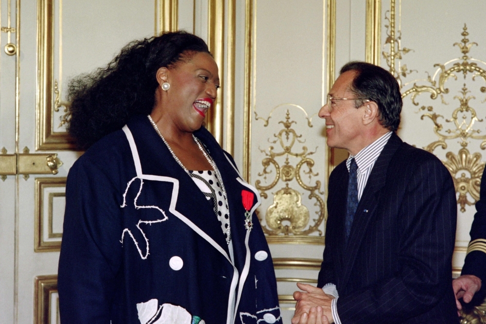 US soprano Jessye Norman, left, speaks with then French Prime Minister Michel Rocard after she was invested with La Croix de Chevalier de La Legion d'honneur in Paris, France, in this June 21, 1990 file photo. — AFP