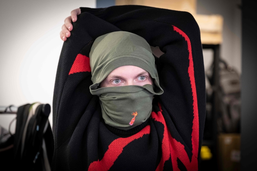 A model wears a creation by the Fashion designer Alina Muzychenko in Moscow on in this Sept. 17, 2019 file photo. The label the 34-year-old runs with her husband Yegor Yeremeyev is among a number of trendy brands making clothes that signal support for Russia's protest movement.
 — AFP