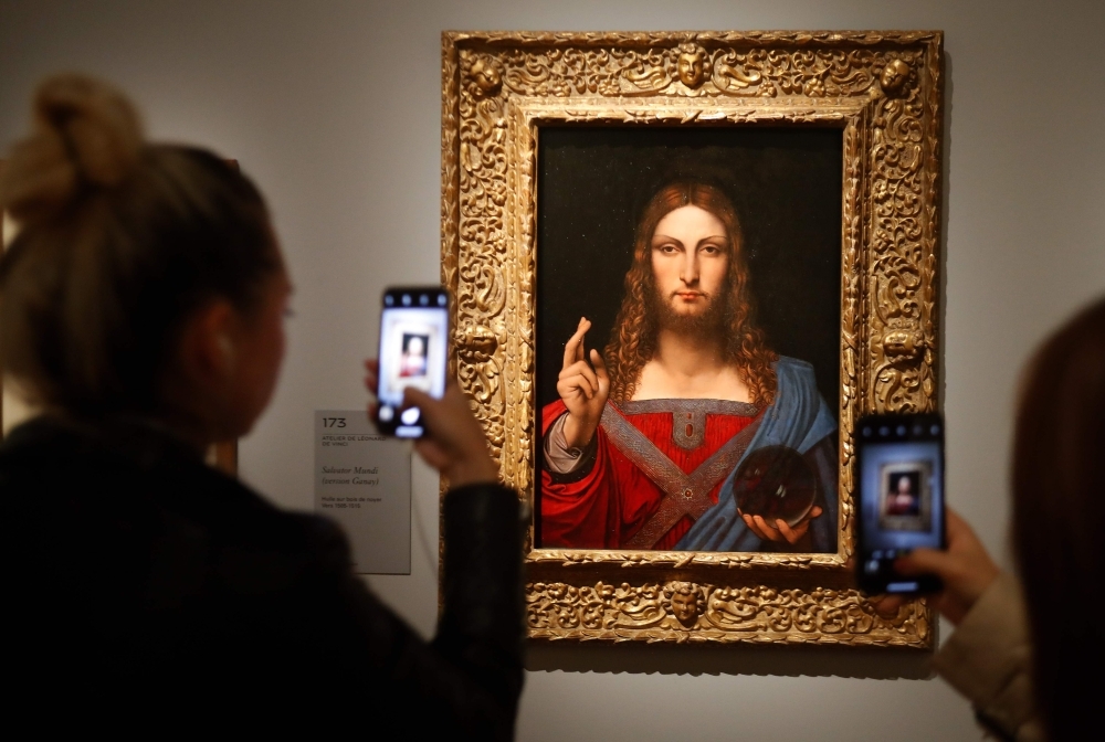 People take pictures with mobile phone at an oil painting by Atelier Leonardo da Vinci's  