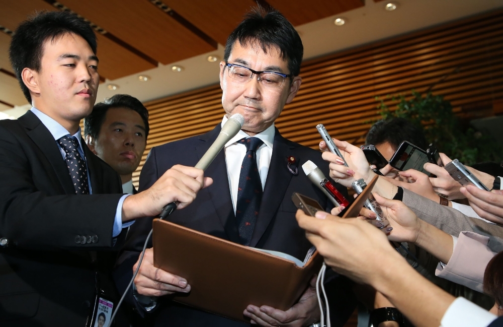 Japan's Justice Minister Katsuyuki Kawai speaks to journalists after submitting his resignation in Tokyo on Thursday. — AFP
