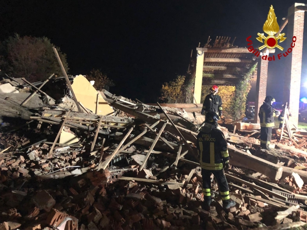 This photo taken and handout on Tuesday by the Italian National Firefighters Corps (Vigili del Fuoco) shows firefighters searching for missing colleagues through the debris of an inhabited building that exploded overnight in Quargnento, in the northern Piedmont region.  — AFP