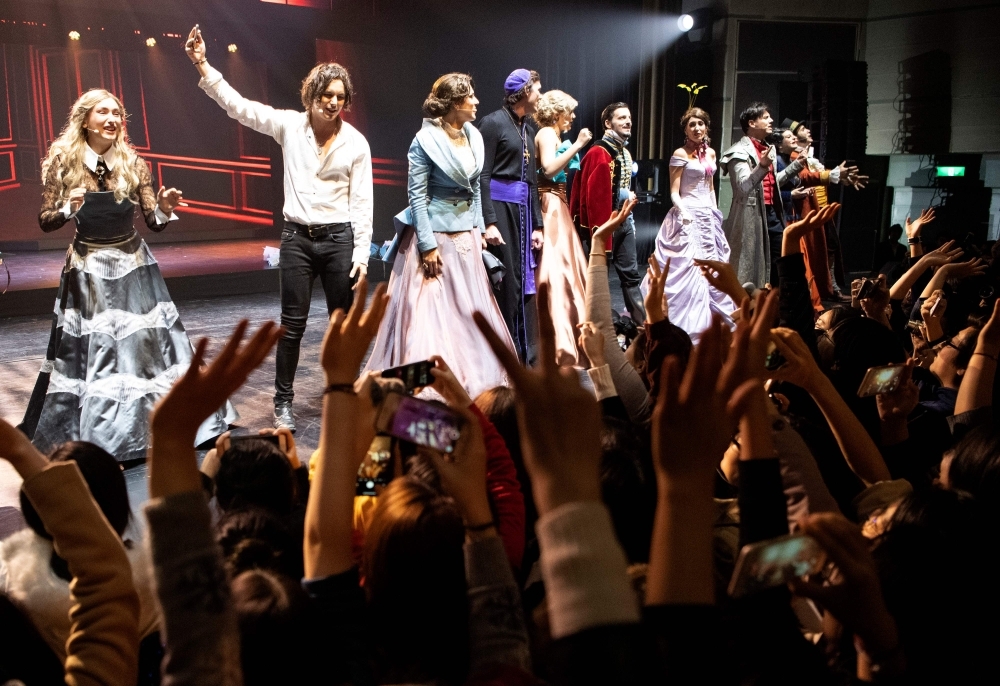 Fans cheer the actors at the end of the French Musical 